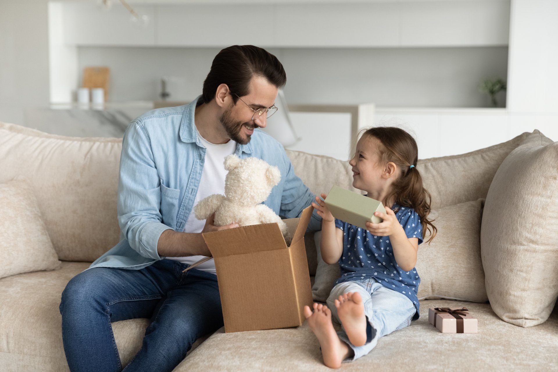 Dad giving gift to his daughter